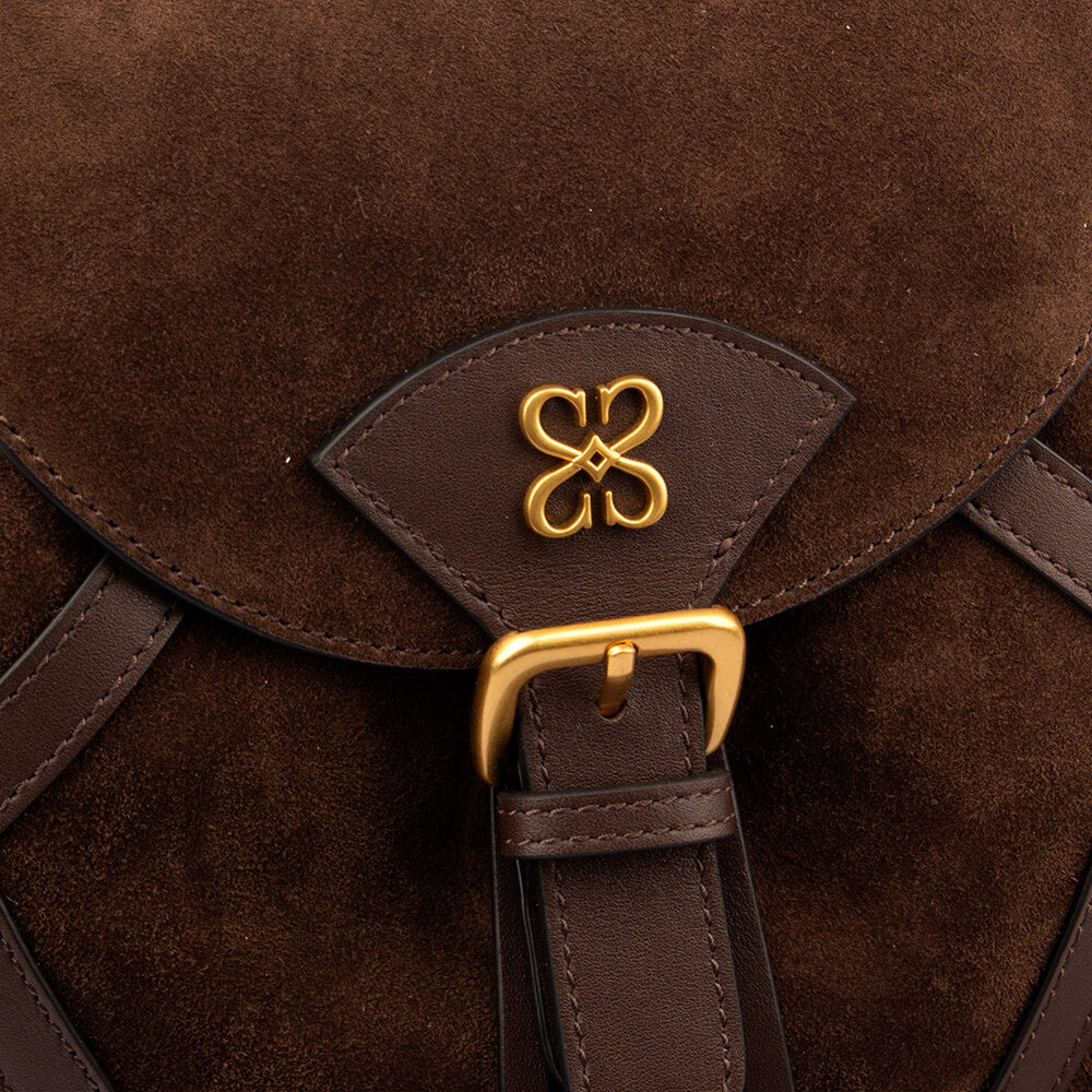 Western-style brown suede backpack with fringe and signature logo emblem