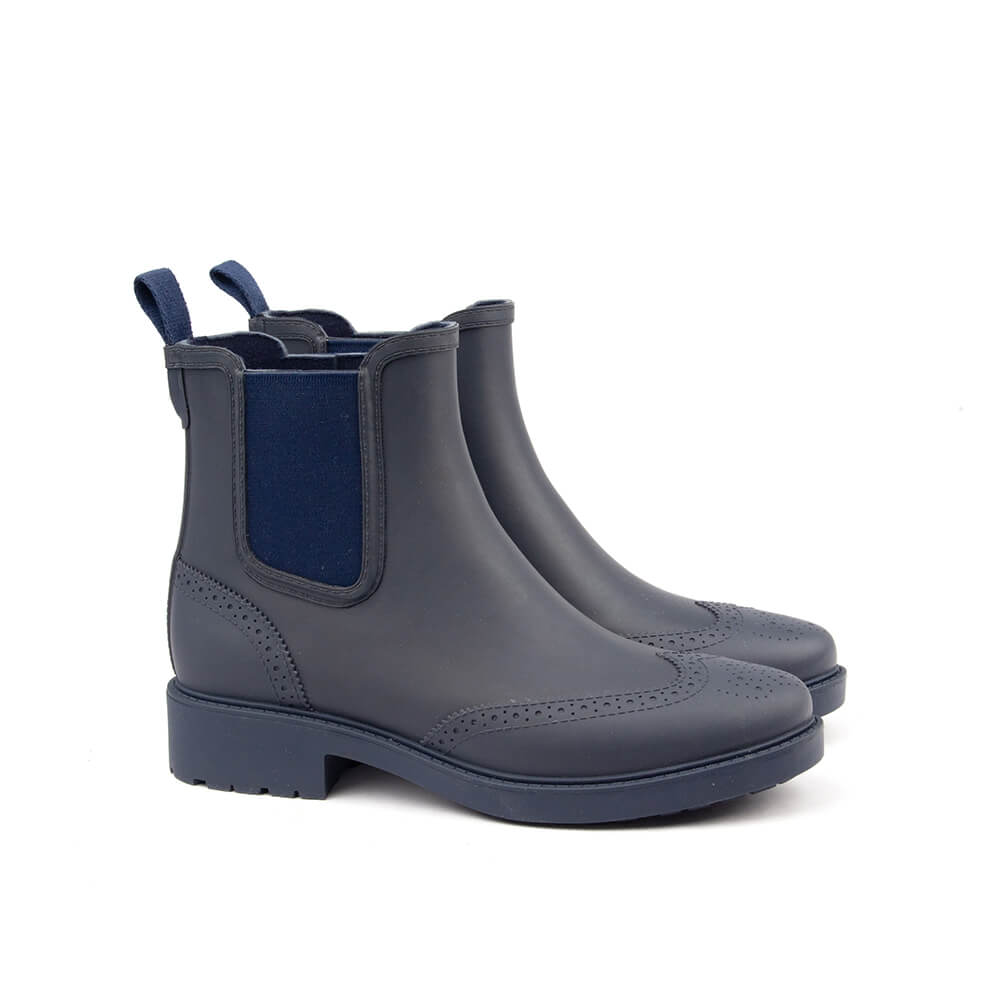 Navy blue rubber Chelsea boots brogue wingtip perforations matte women