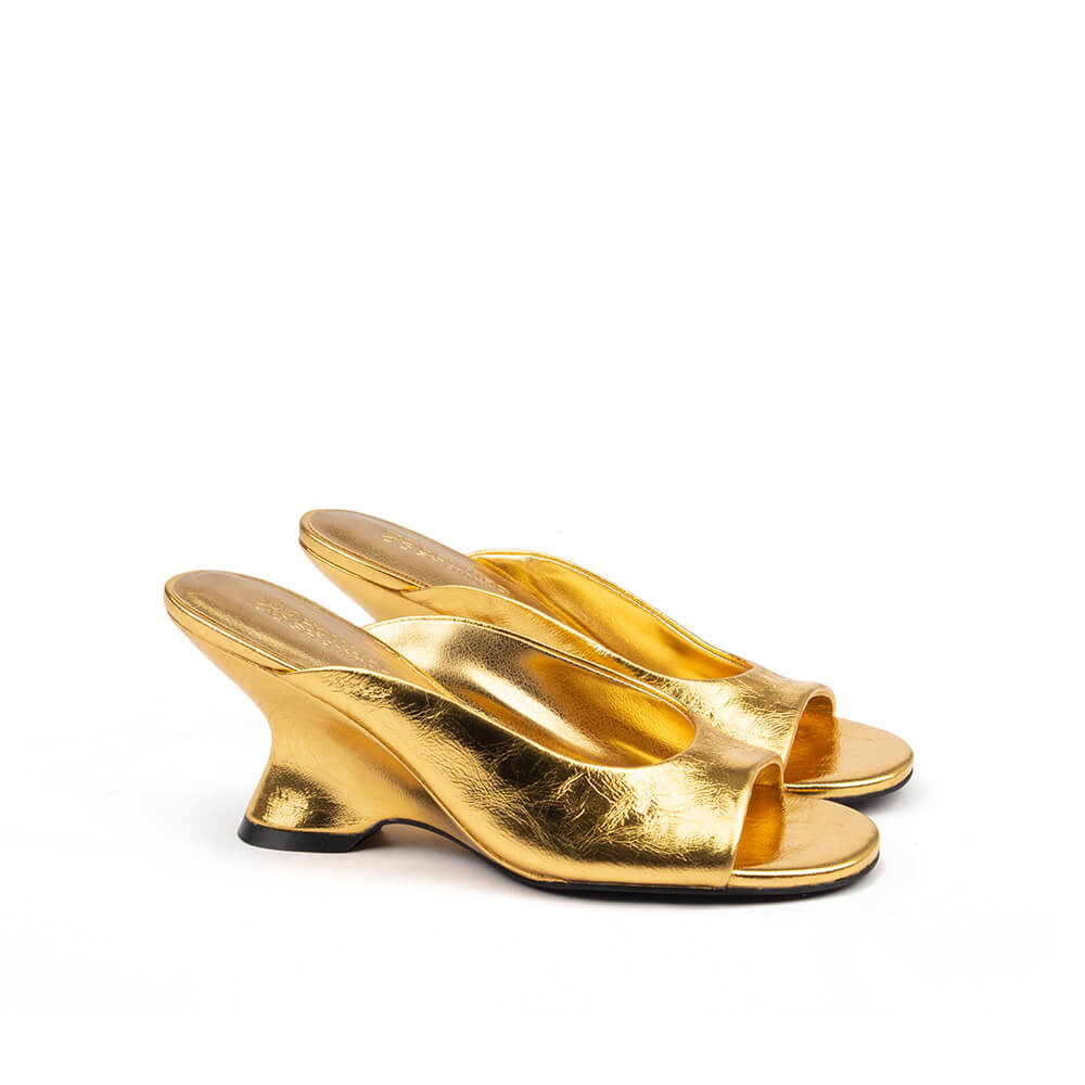 All-over gold metallic leather mules sculpted curved wedge heel women