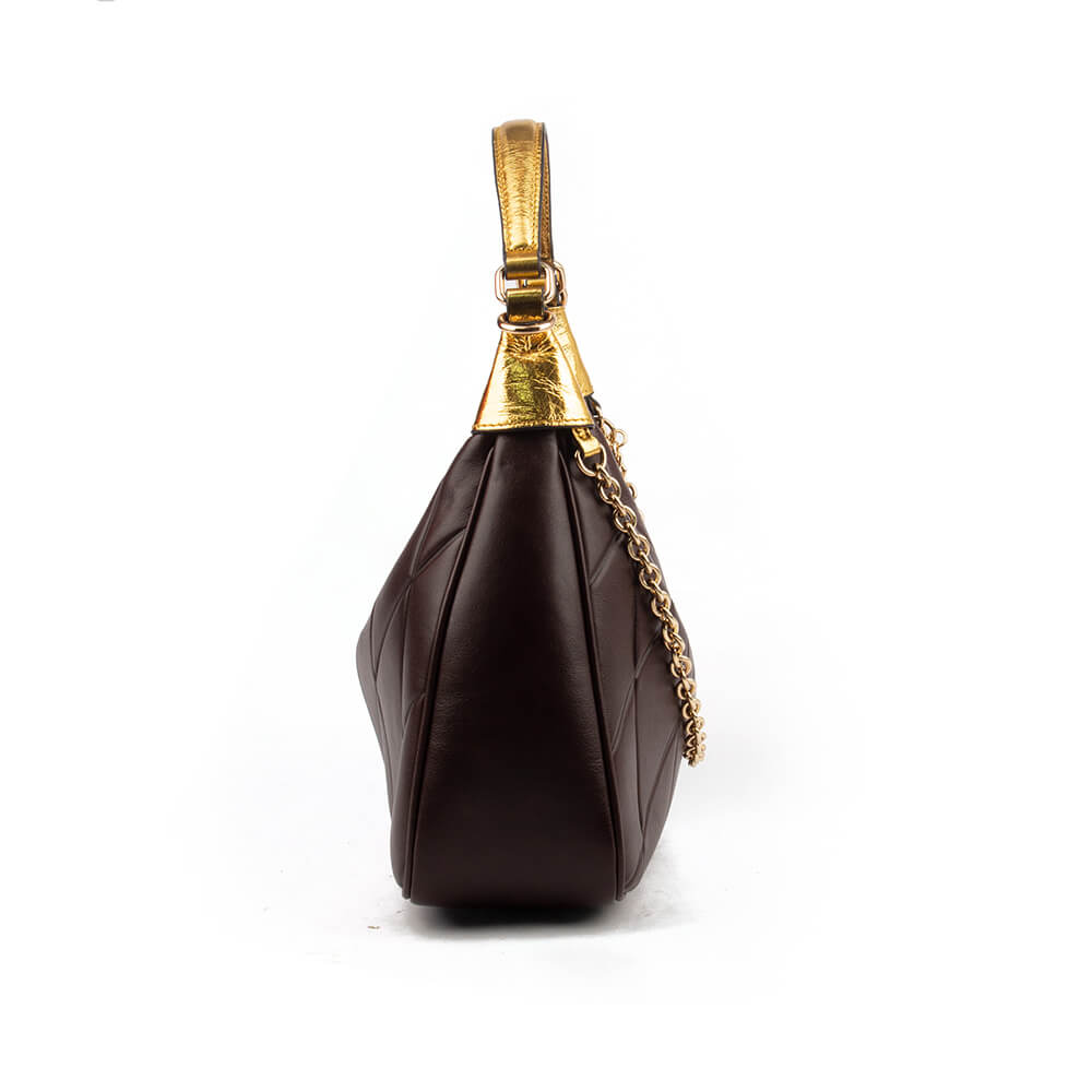 Brown quilted leather crescent bag with gold chain strap and logo charm