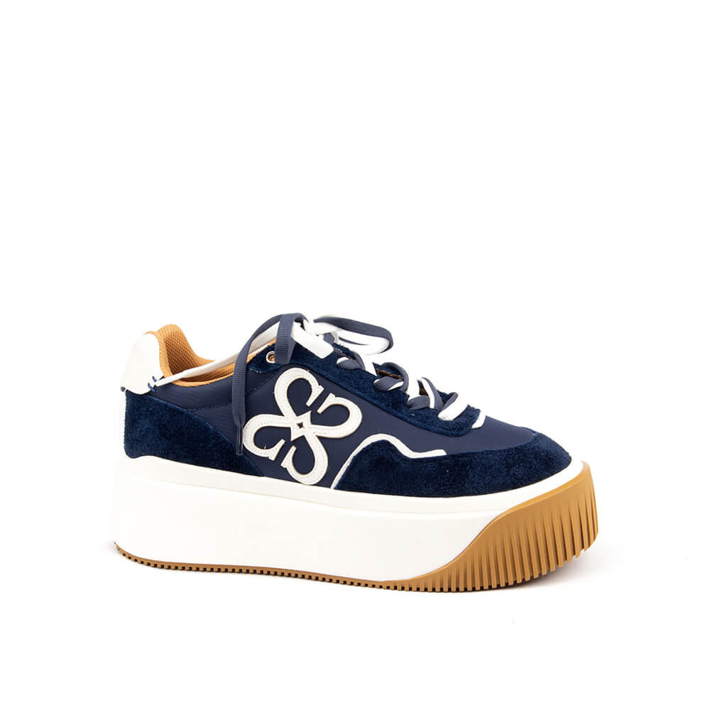 Midnight navy platform sneakers with embroidered signature logo and lace-up front