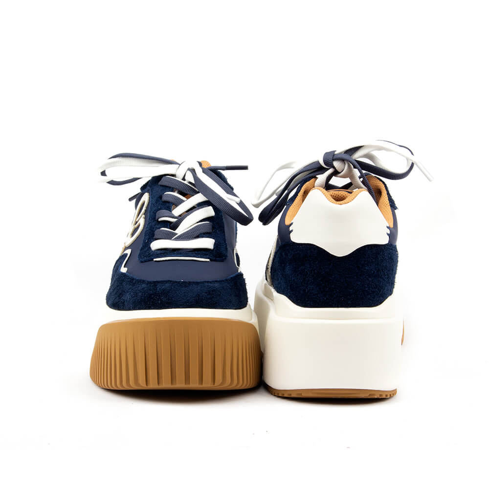 Navy and white chunky platform sneakers with gum rubber outsole and logo detail
