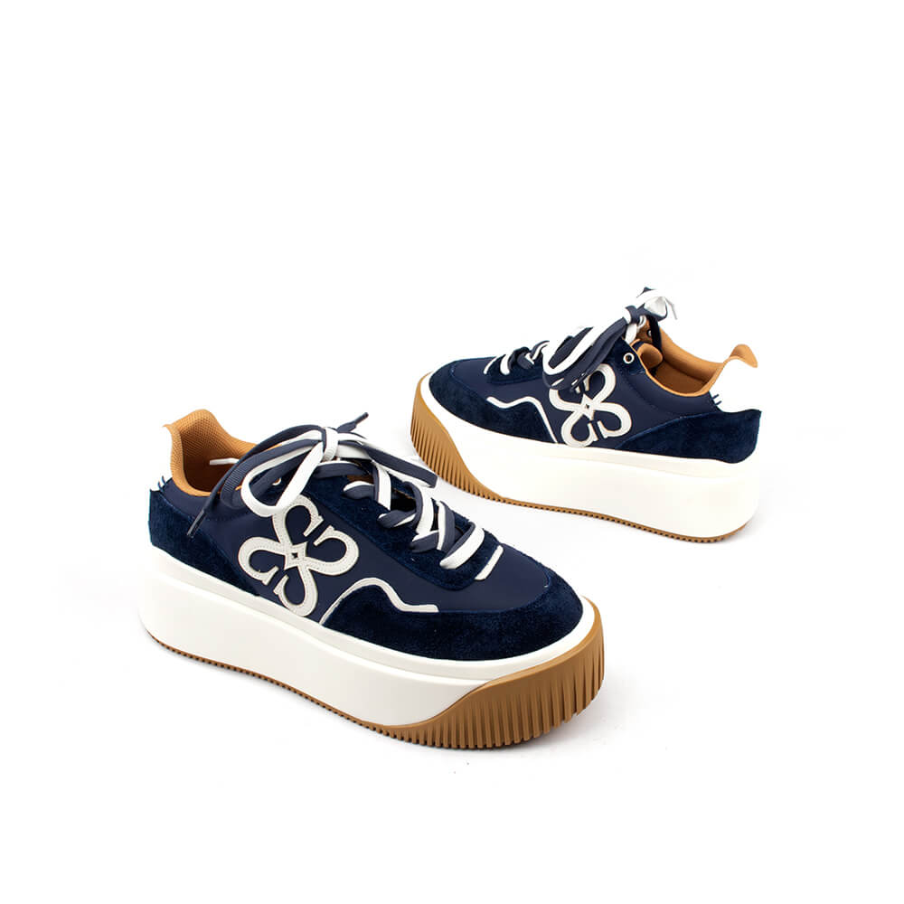 Women's elevated sneakers in midnight navy with tan heel tab and white sole
