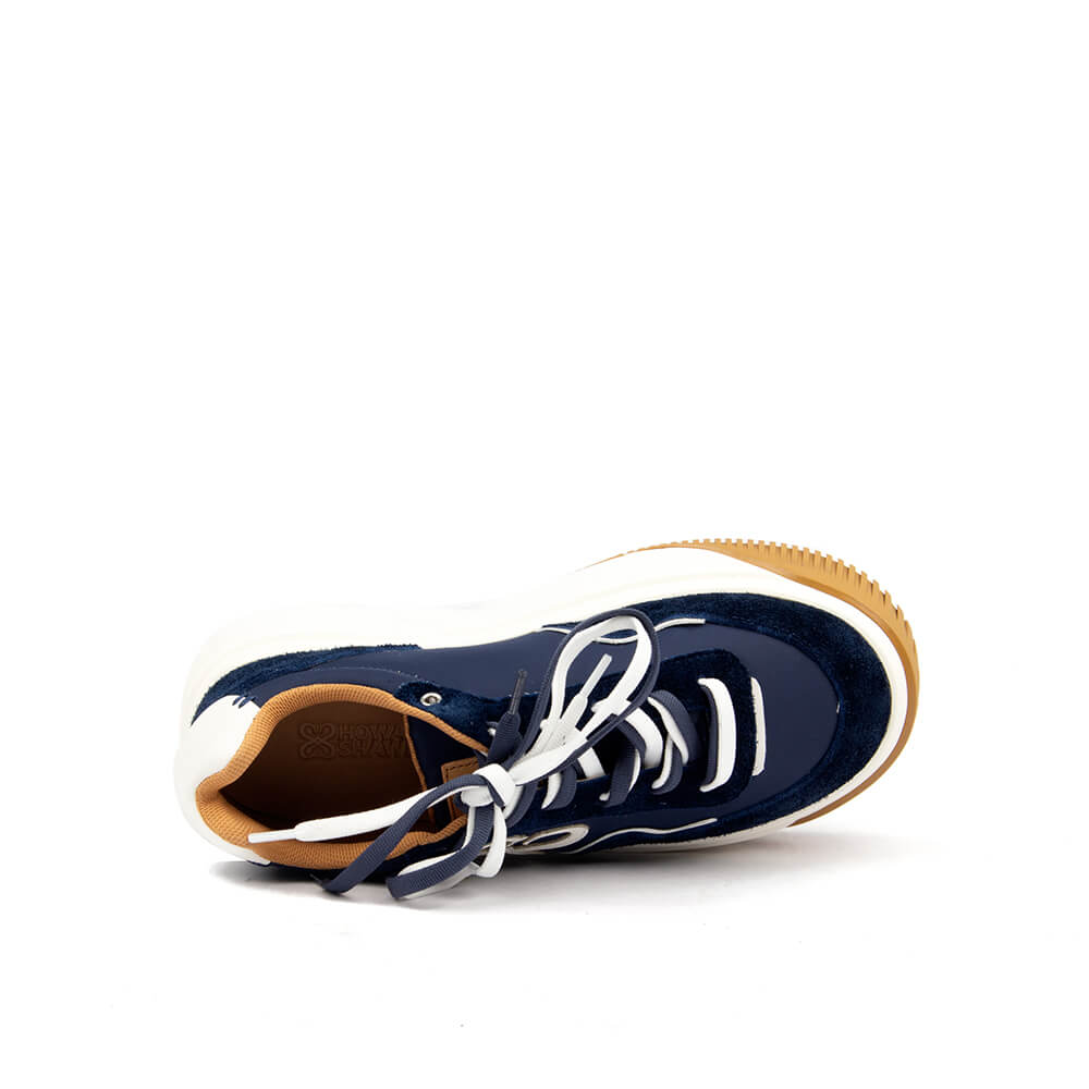 Platform trainers with navy suede panels and bold white logo appliqué