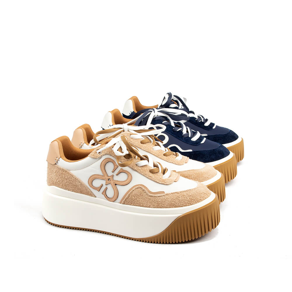 Midnight navy mixed material sneakers with white midsole and signature emblem