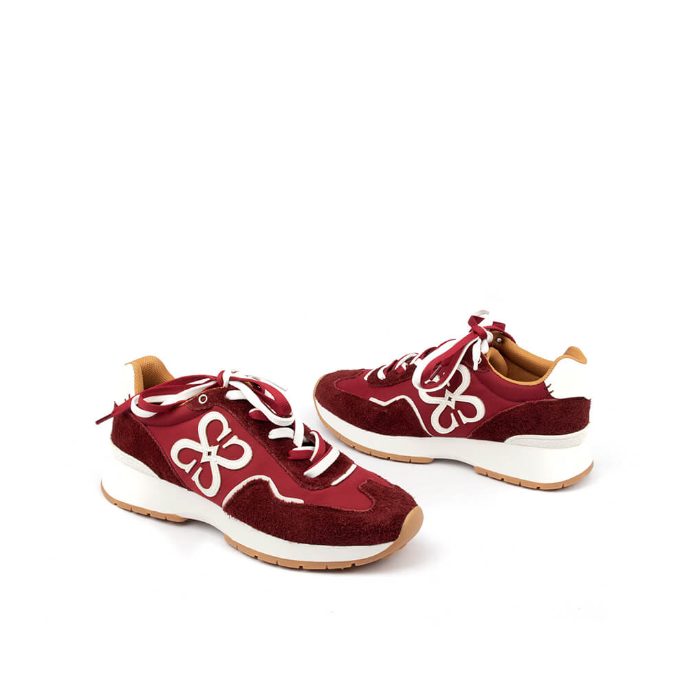 Retro runner trainers in rich red with white logo detail — side view