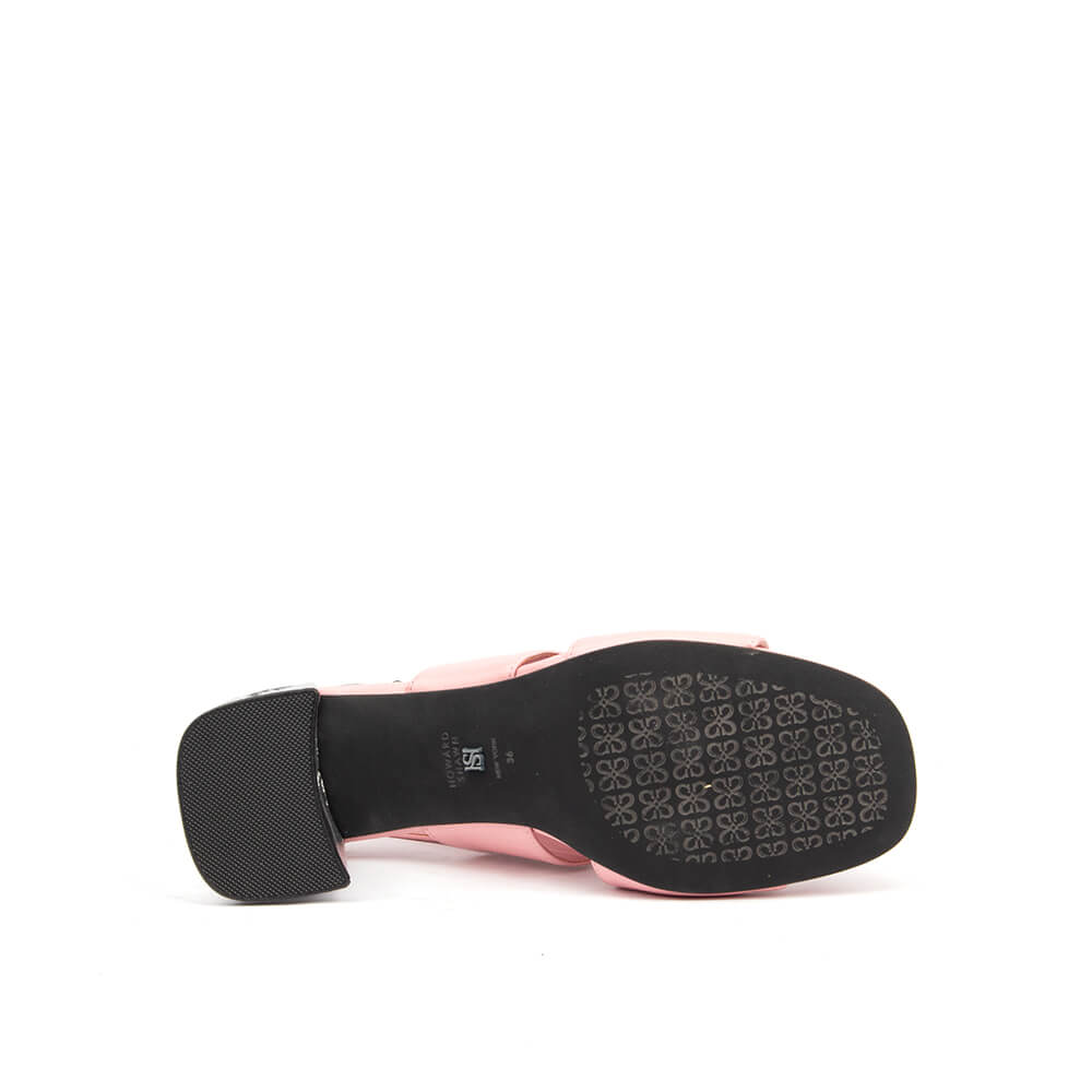 Blush pink slingback heels with wide double strap and signature logo buckle