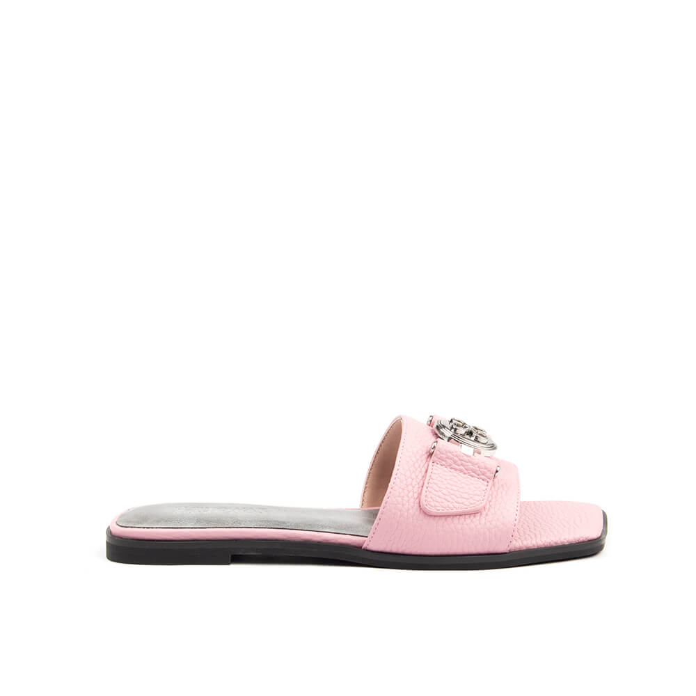 Blush pink pebbled leather flat slide sandal with silver logo medallion