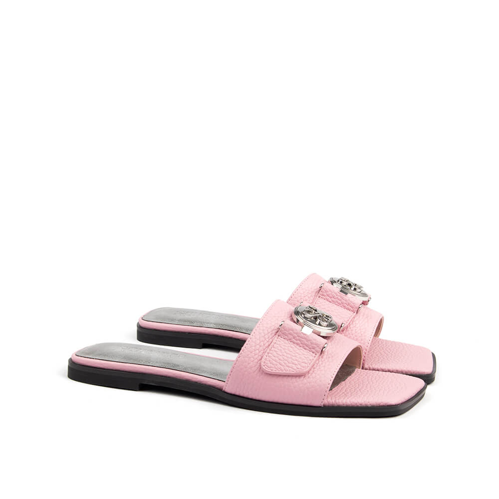Chic blush pink flat slide sandal with silver logo for spring or summer