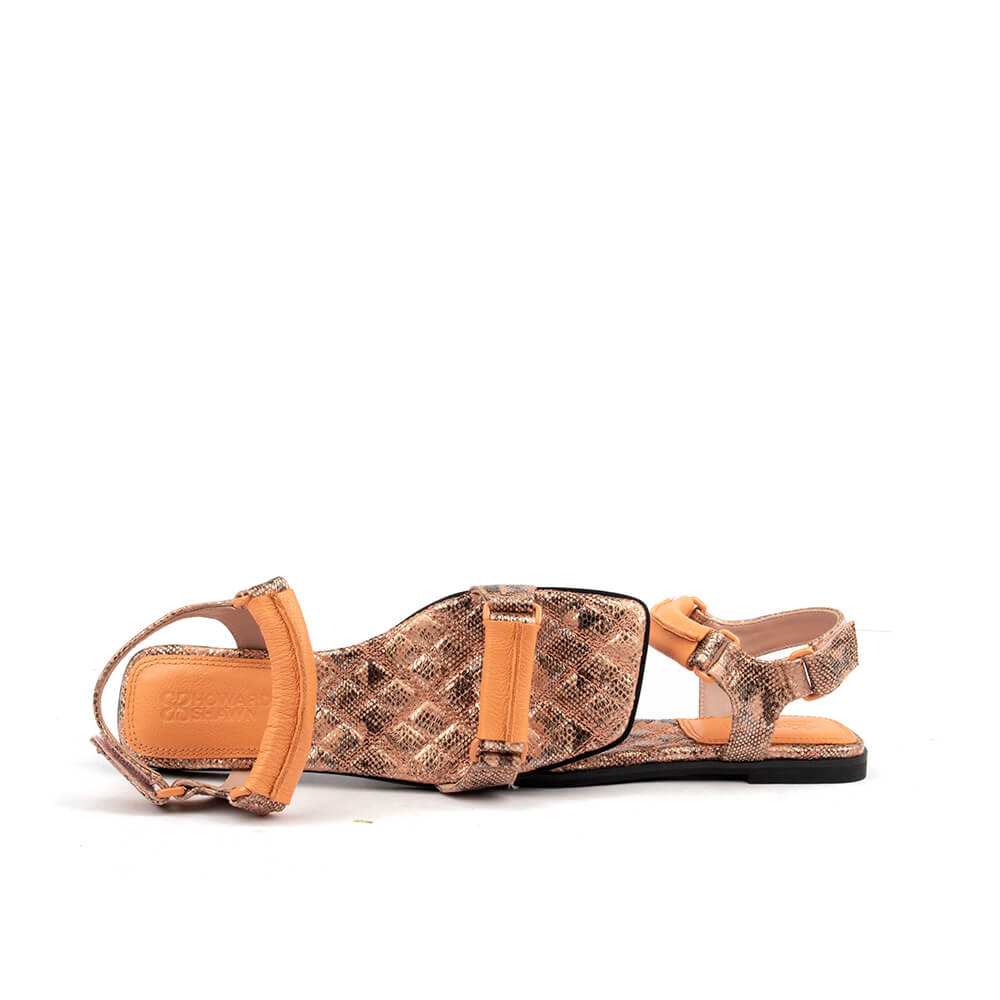 Snake embossed leather flat sandals with ankle strap in peach snake colorway