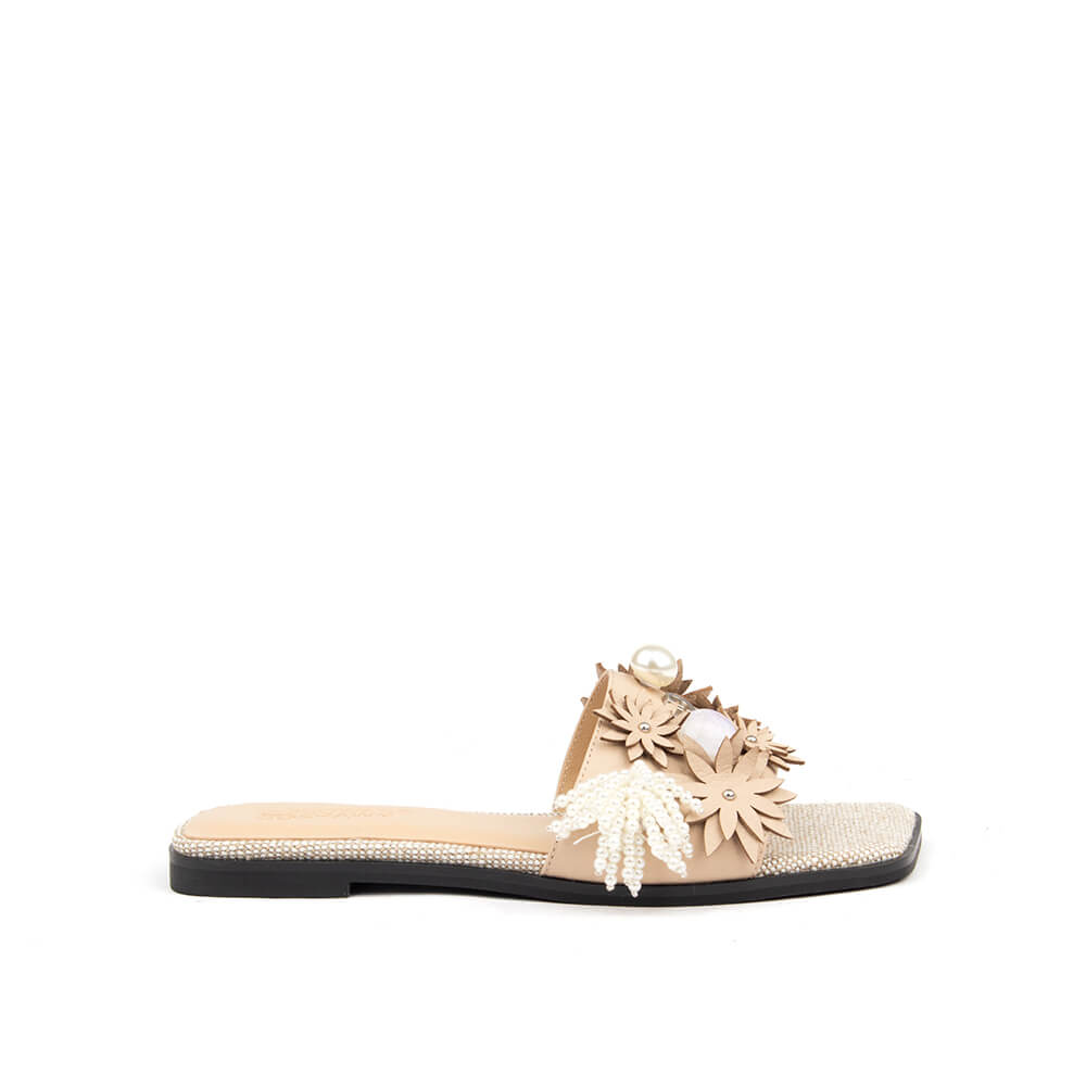 3D floral embellished flat slide sandals in sand blush with pearl tassel and rhinestone footbed