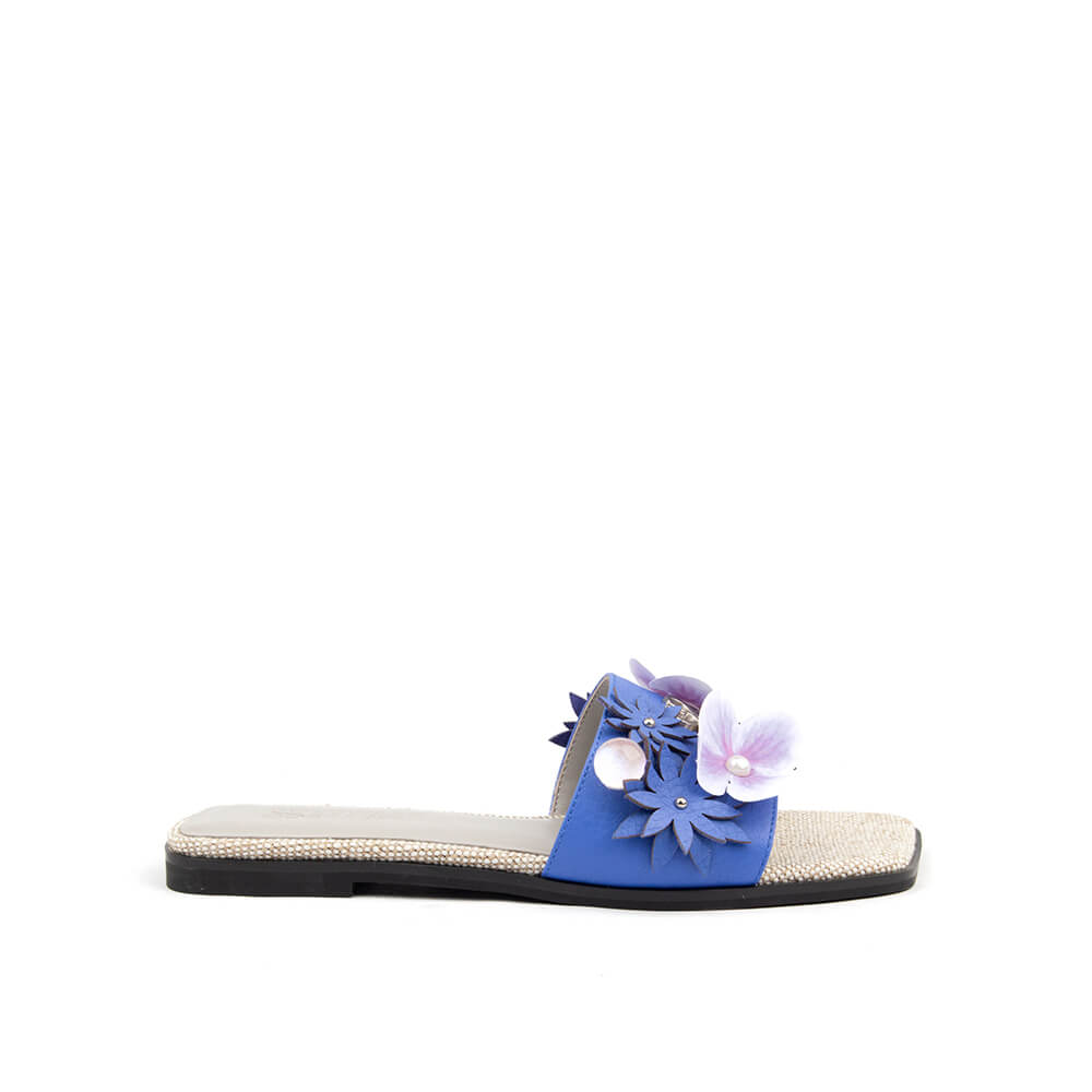 3D floral flat slide sandals in cobalt blue with lilac flower and pearl detail