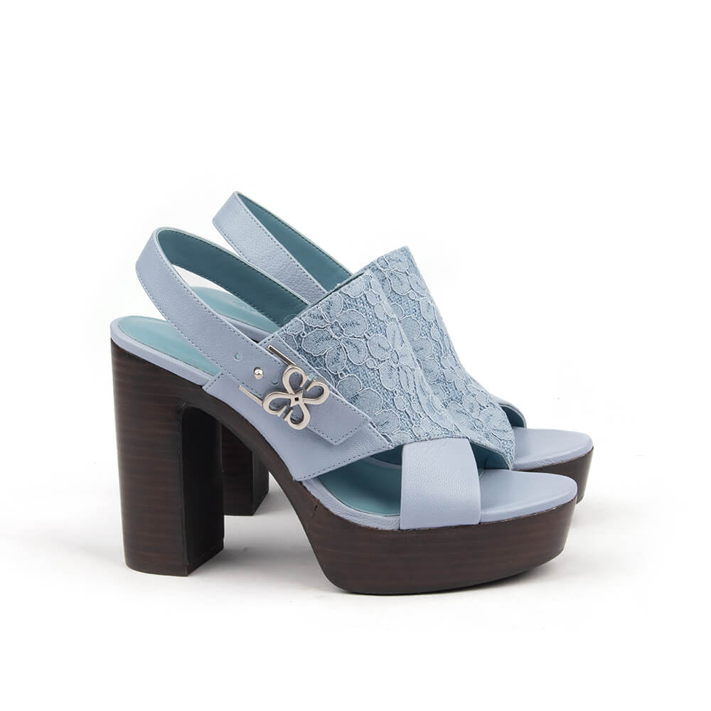 Powder blue lace block heel sandals with leather crisscross strap and silver hardware