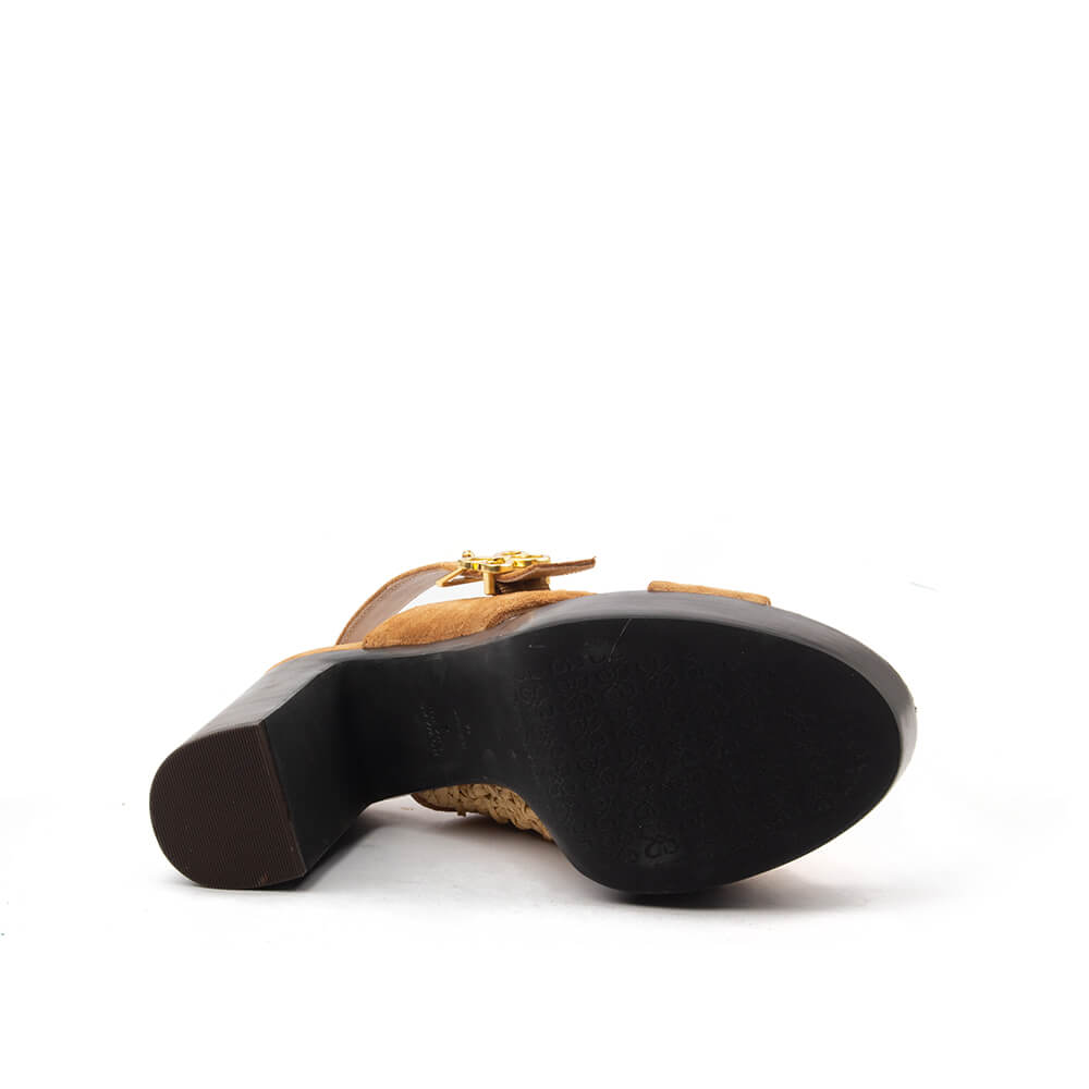 Tan suede open toe slingback with raffia panel and gold signature buckle — side view