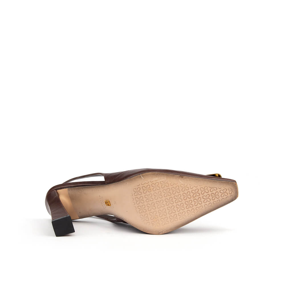 Brown leather block heel slingback shoes with polished gold toe accent — bottom view