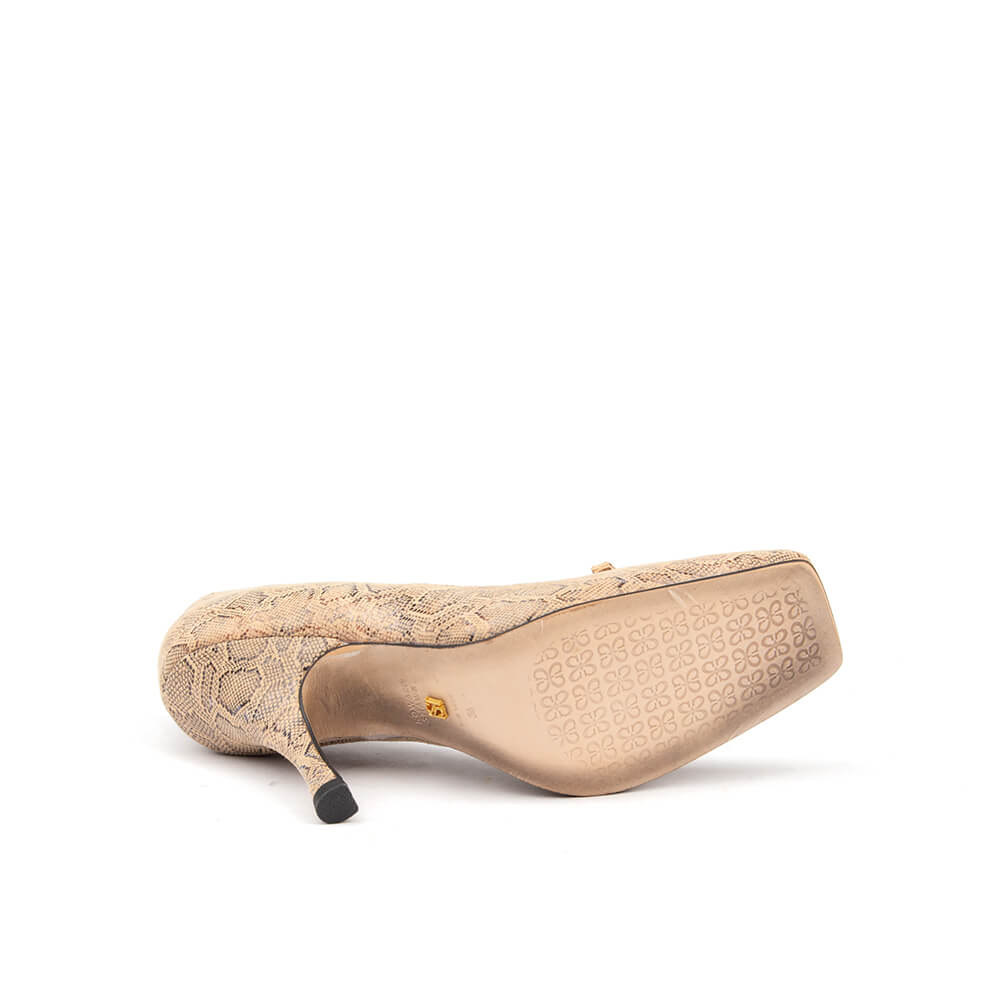 All-over lace stiletto court heels with gold signature logo buckle — bottom view