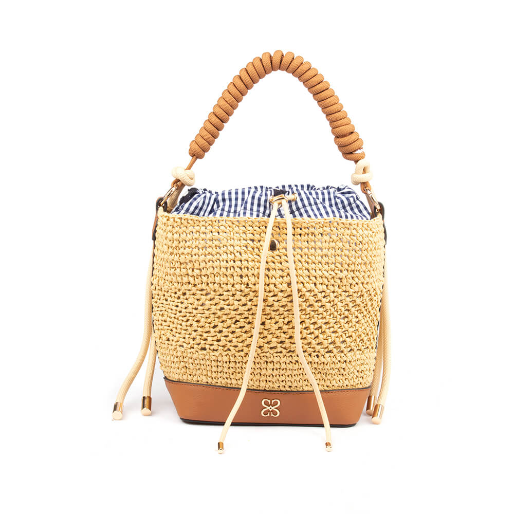 Woven straw bucket bag with tan leather base and coiled rope handle