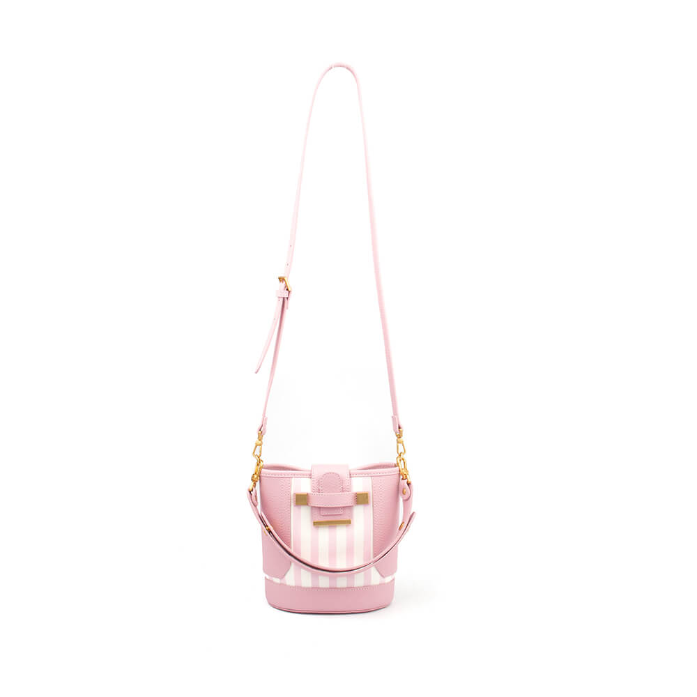 Petal pink mini bucket bag with vertical stripe canvas panel and gold hardware