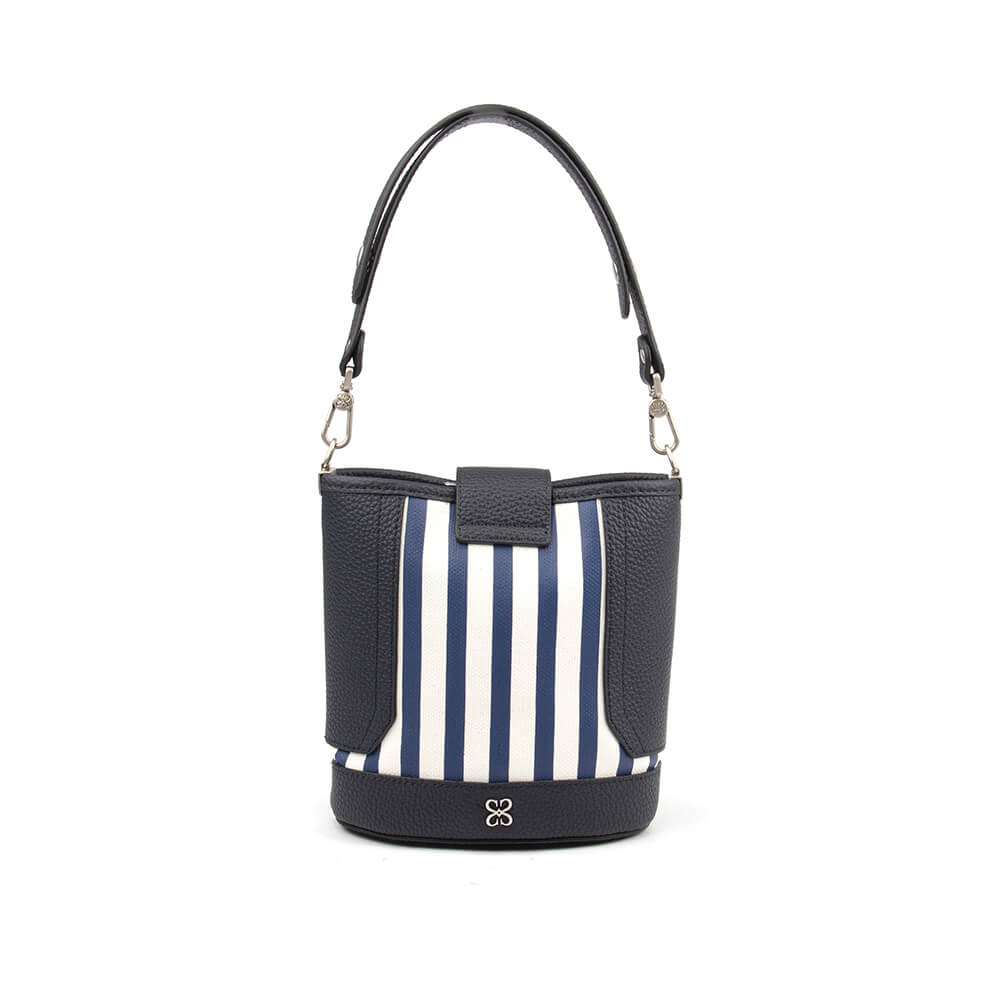 Navy and white striped structured bucket bag with signature emblem at base
