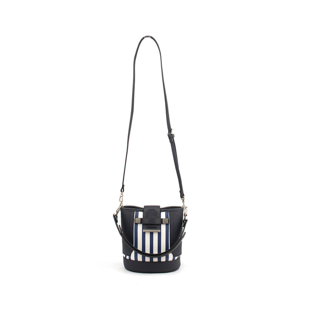 Pebbled leather navy bucket bag with stripe front and swivel clip strap detail