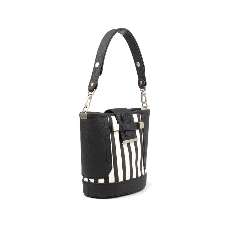 Monochrome stripe bucket bag with metal bar closure and adjustable top handle