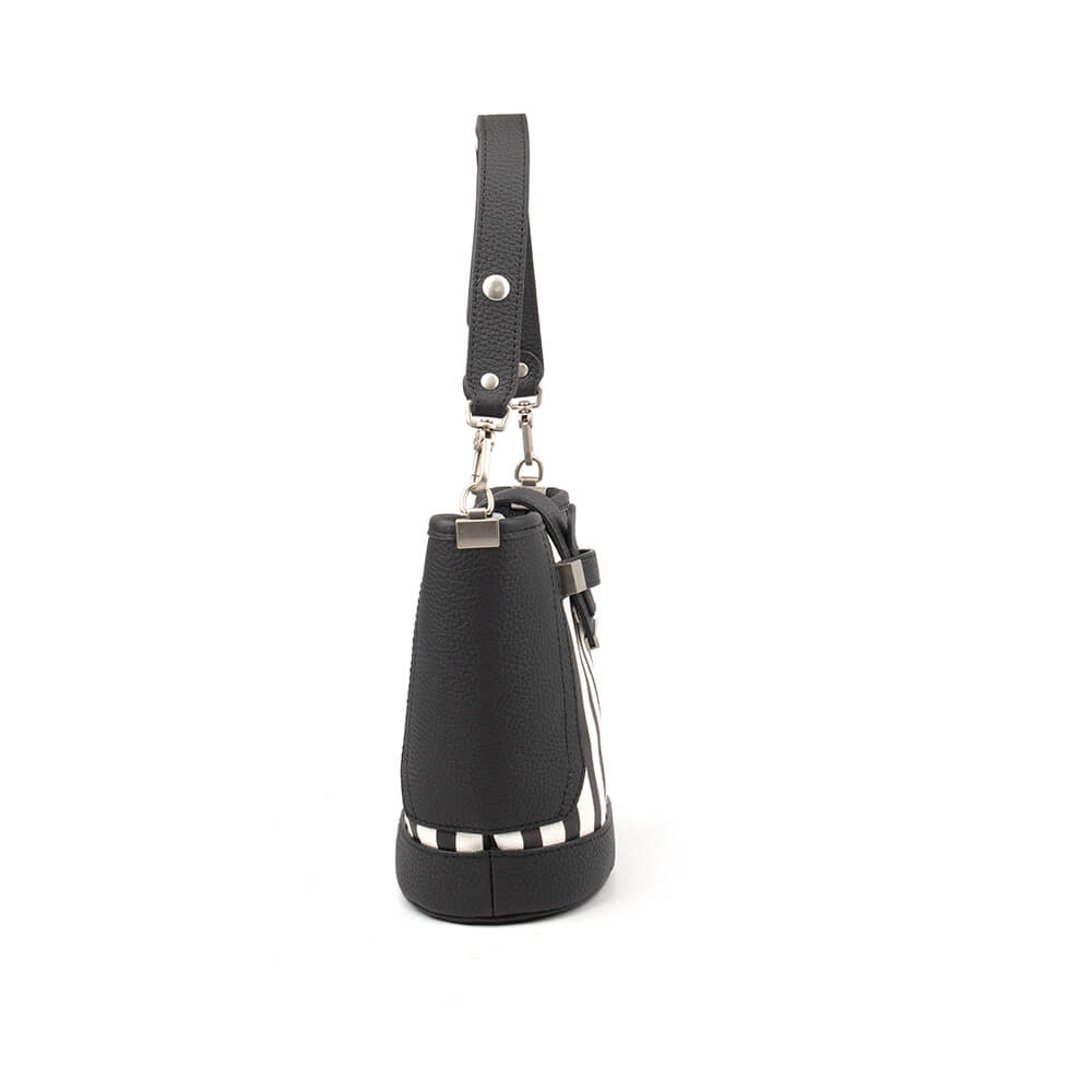 Black and white striped mini handbag with logo emblem and crossbody strap