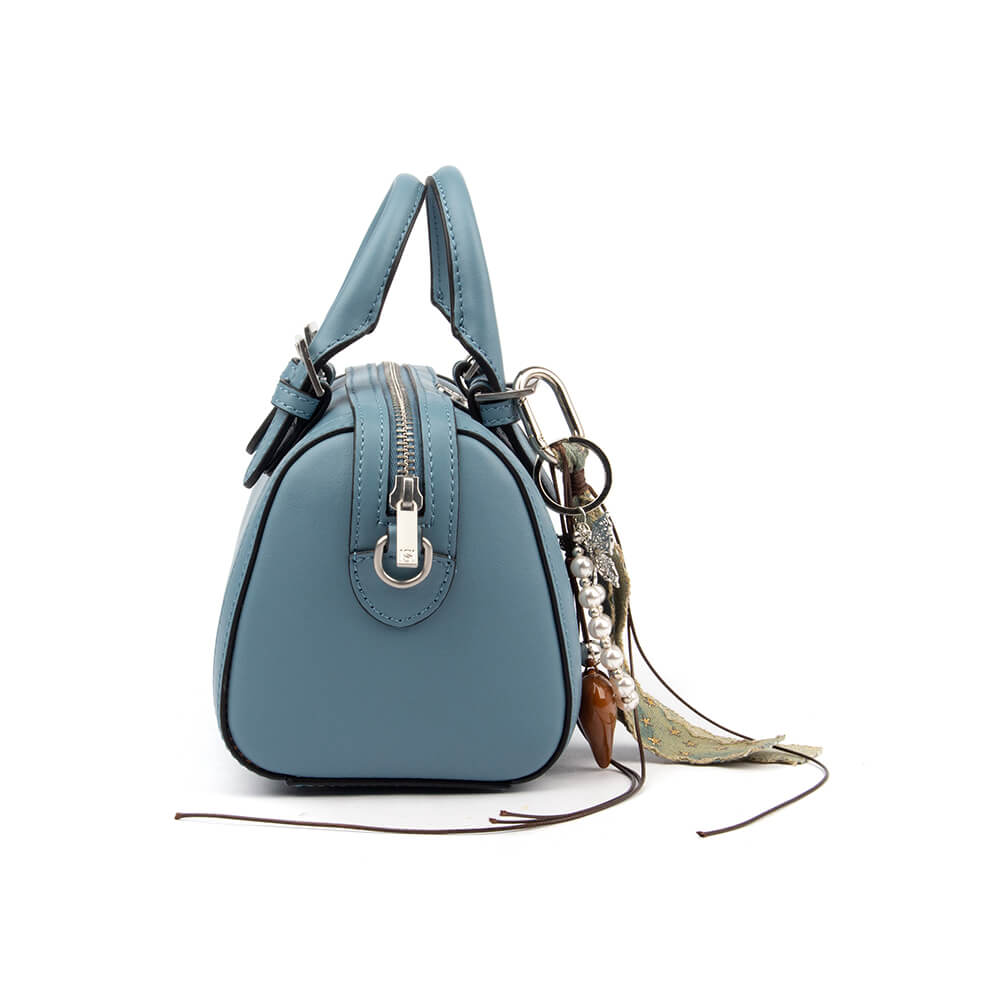 Smooth steel blue leather mini bag with zip closure silver hardware and pearl charm