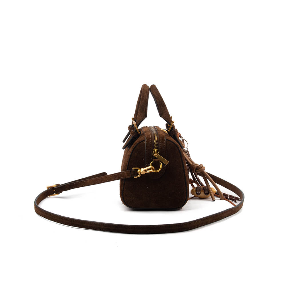 Small brown suede crossbody bag with carabiner charm clip and leather tassel