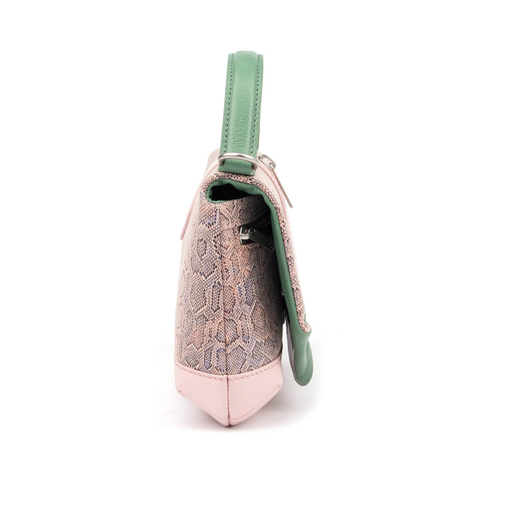 Iridescent snake leather flap bag with contrasting green leather trim in pink