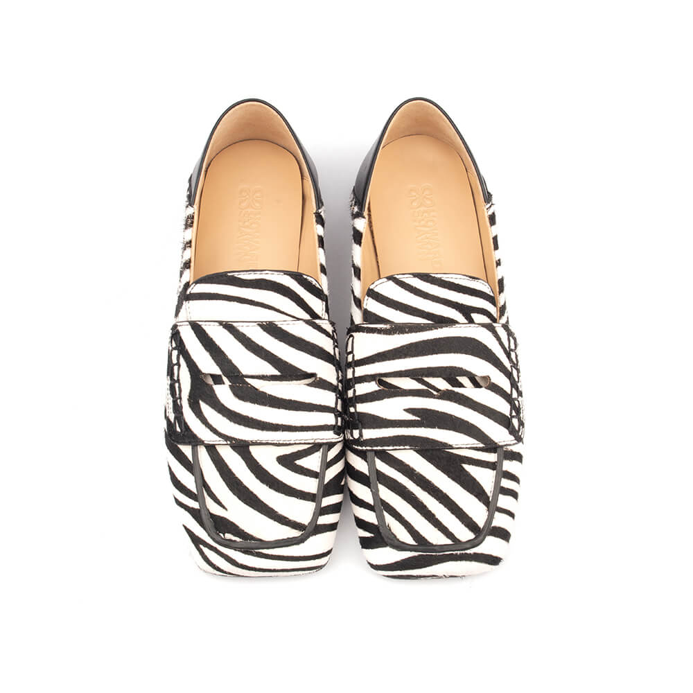 Trendy women's zebra print flat loafers pair
