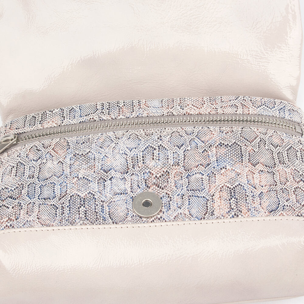 Iridescent snake print mini bag in off-white with silver zipper and stud detail