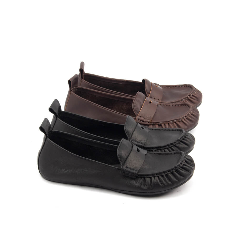 Women's black flat loafer genuine leather white background
