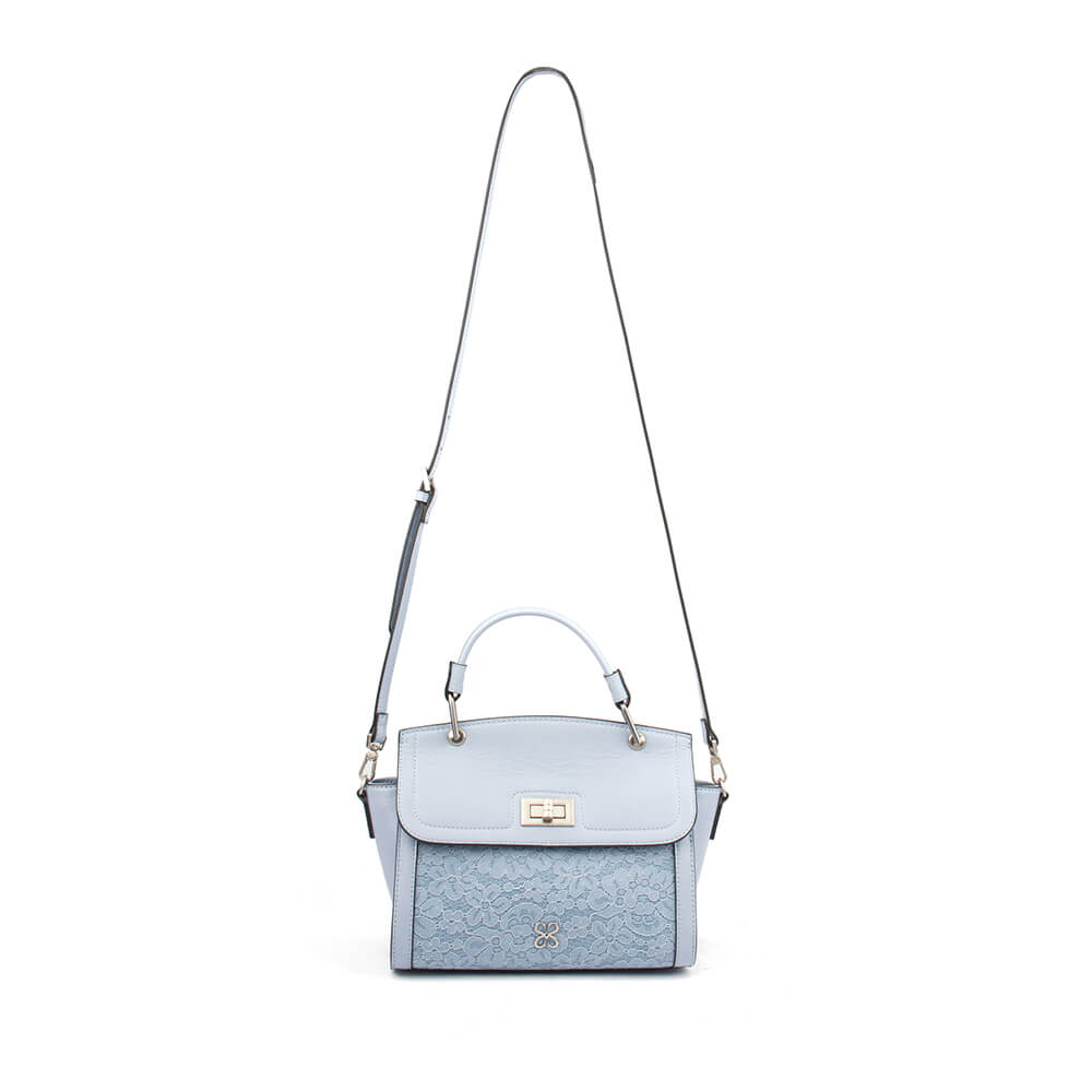 Powder blue leather satchel with floral lace overlay and gold turn-lock closure