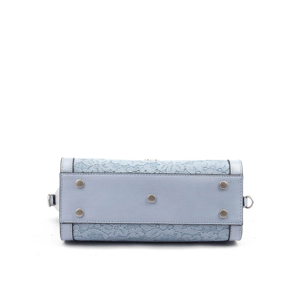 Light blue leather flap bag with lace detail and adjustable crossbody strap
