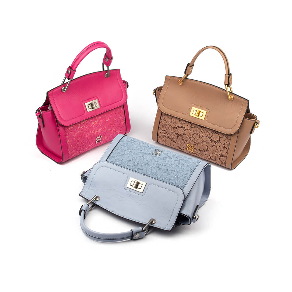 Women's pastel blue satchel with lace front pocket and signature logo hardware