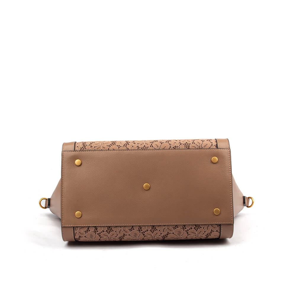 Oversized pebbled leather winged bag in taupe with lace overlay and logo emblem