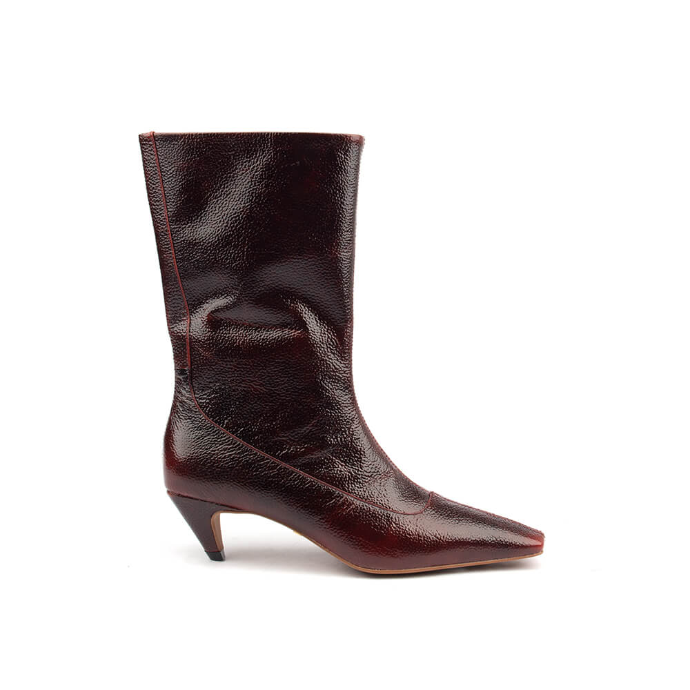 Women's oxblood patent leather kitten heel mid-calf boots pair