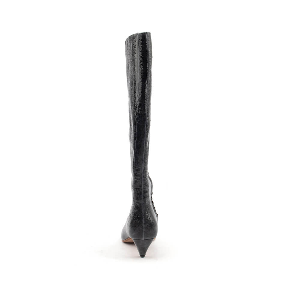 Women's crinkled patent leather knee boot black white background