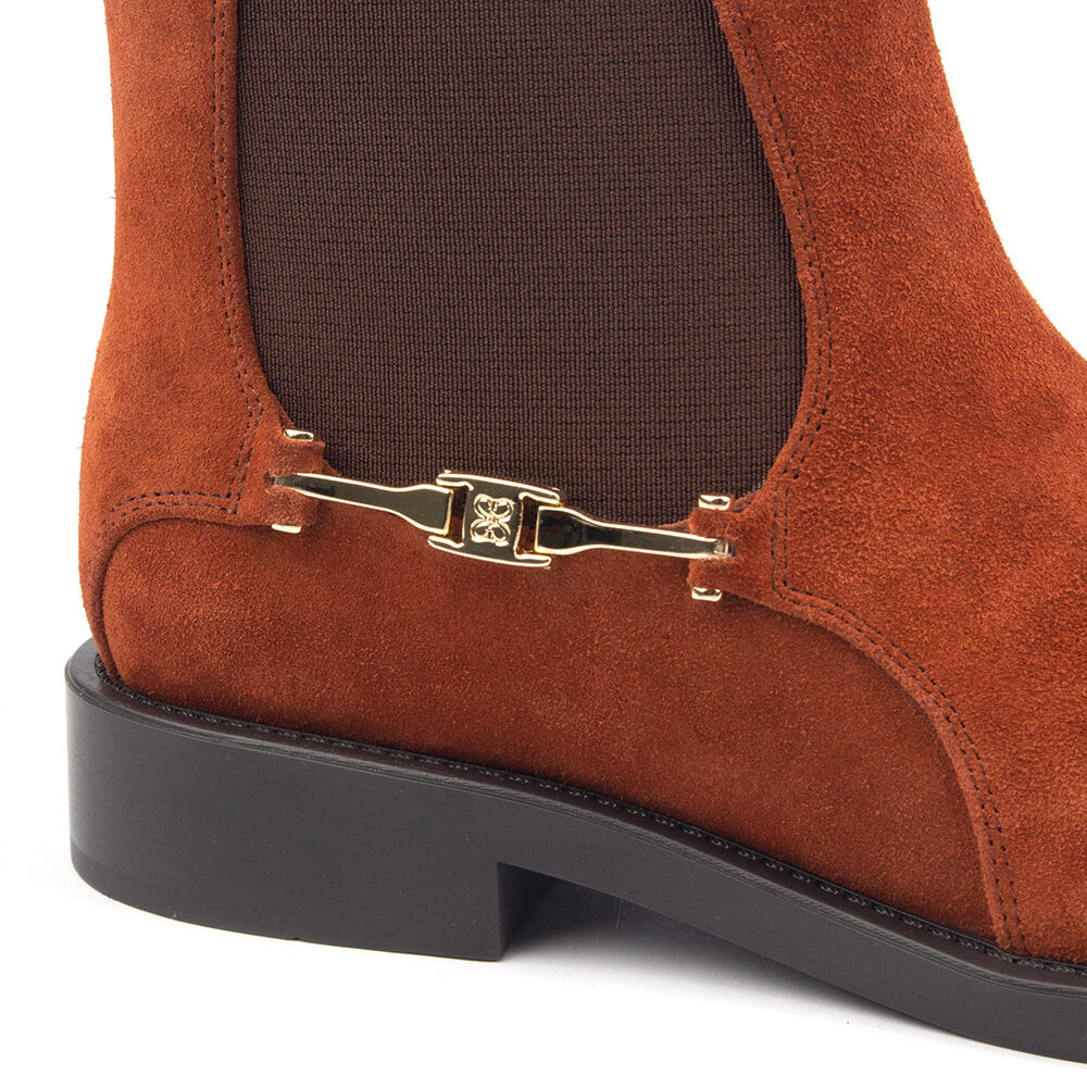 Warm toffee amber suede ankle boots with equestrian gold hardware accent
