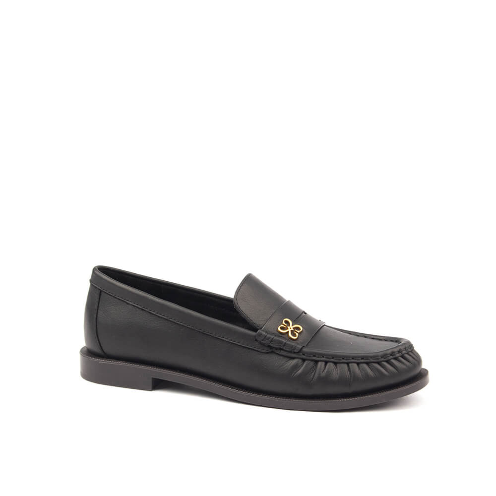 Women's black leather penny loafers with gold floral logo detail