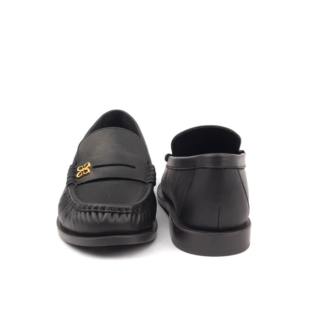 Smooth black leather penny loafers with moccasin toe and gold logo