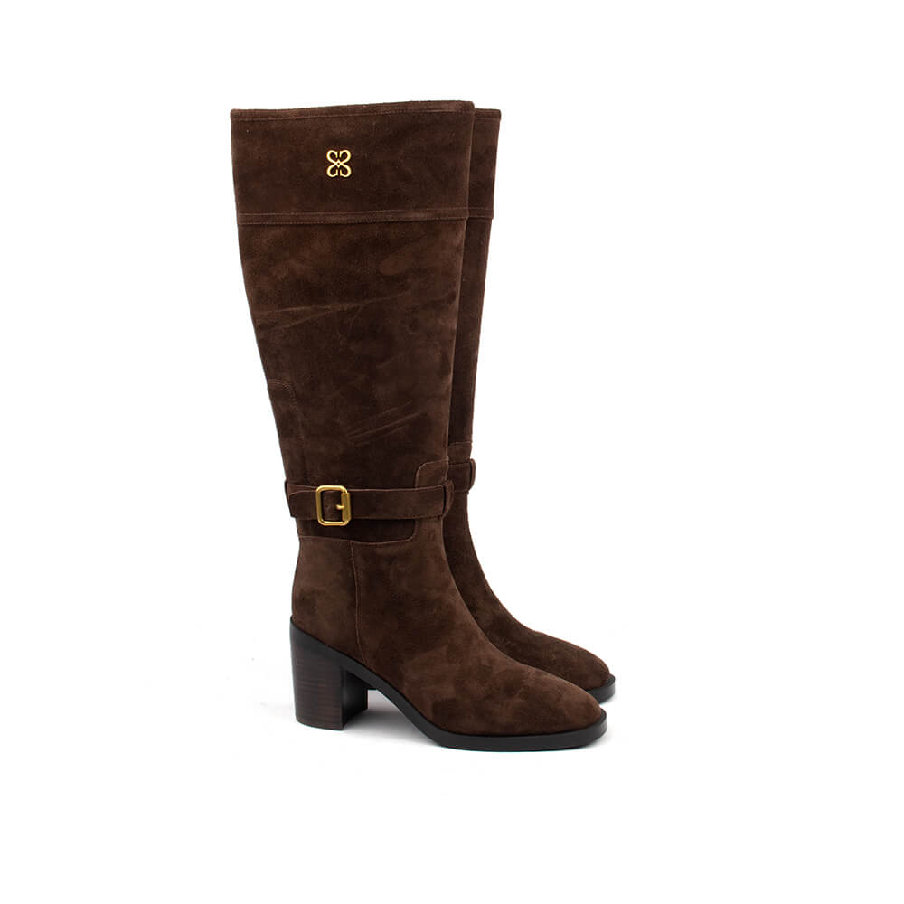 Rich cocoa suede riding boots with gold four-petal emblem and ankle strap for women
