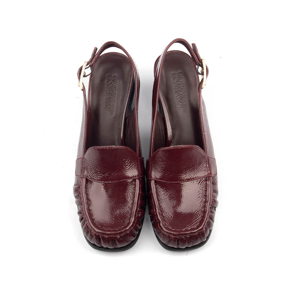 Women's oxblood patent leather open-back loafer heels with gold buckle strap