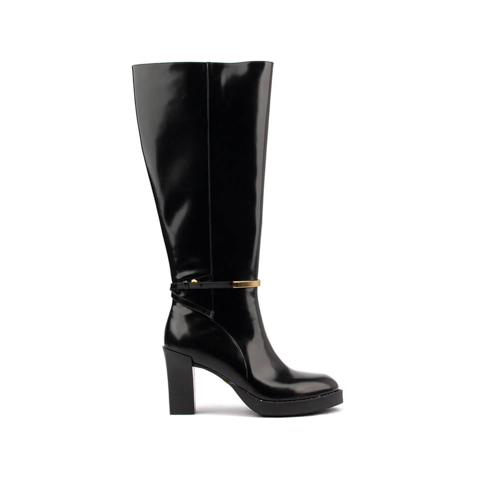 Women's jet black patent leather knee-high boots with gold bar ankle strap and block heel