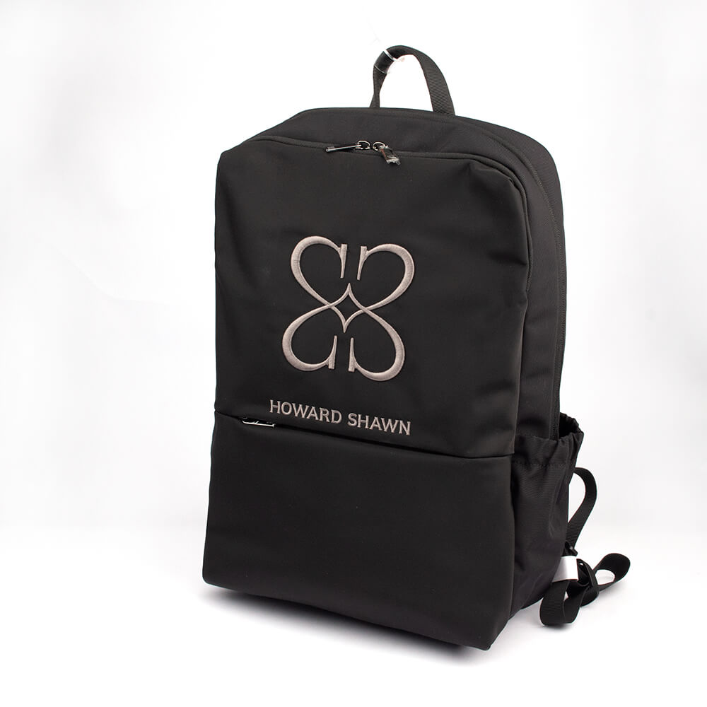 Unisex luxury black backpack with Howard Shawn signature logo and adjustable straps
